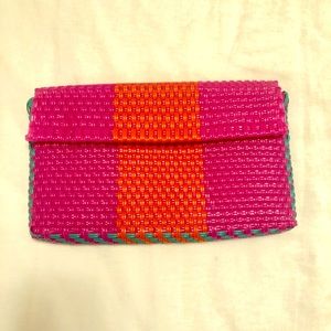 Revolve Bright colored weaved artisan clutch